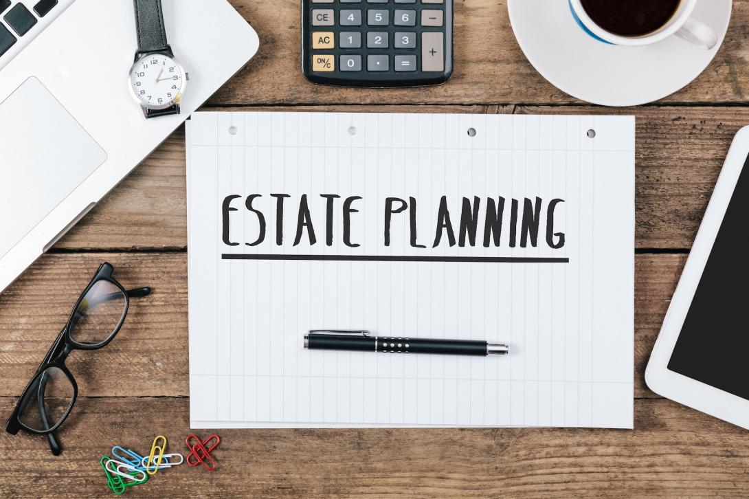 Estate Planning written on legal pad on work desk
